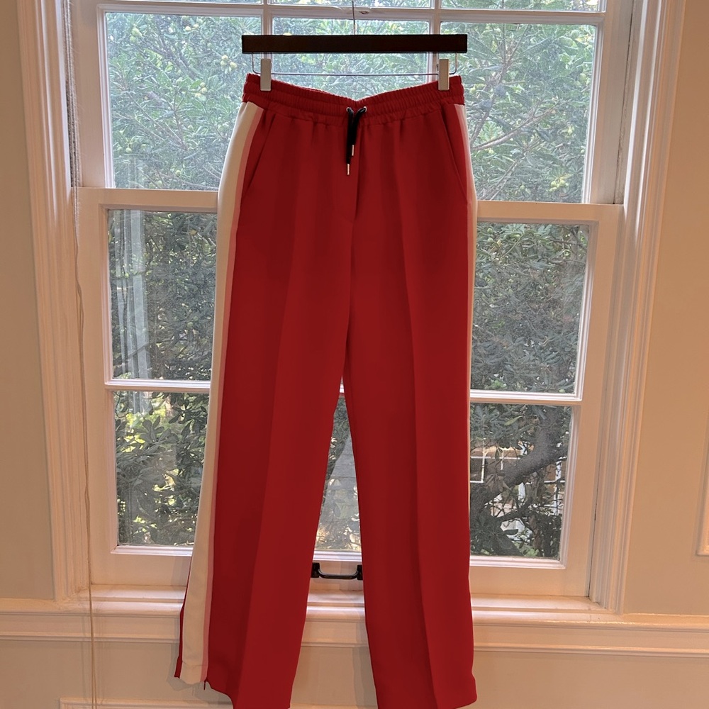 Barbara Bui track pants with elastic waits, side pockets and zippers at ankles.